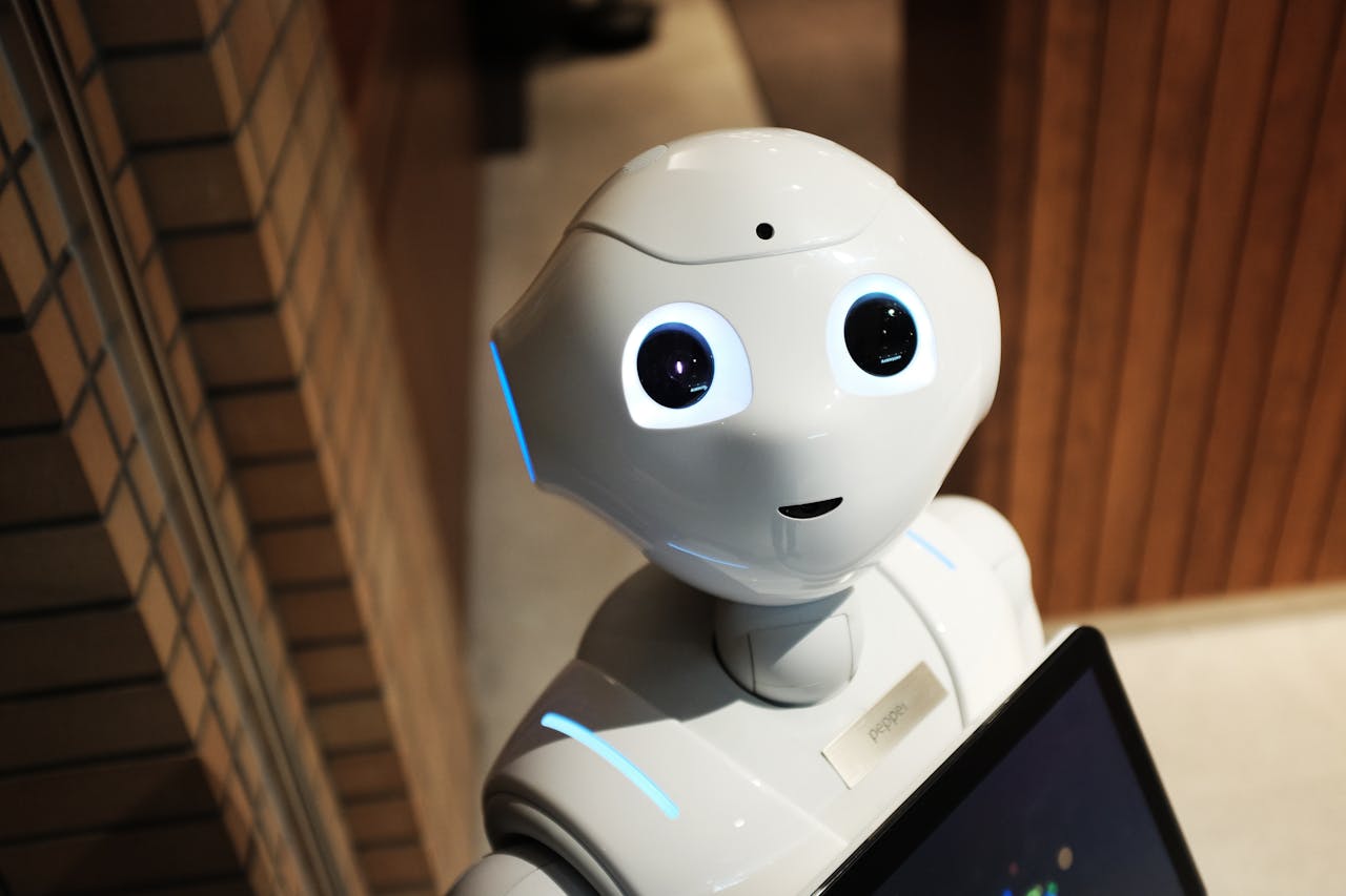 hero-img-02 A futuristic humanoid robot in an indoor Tokyo setting, showcasing modern technology.