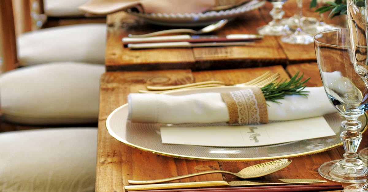 Close-up of a beautifully arranged table setting with flowers and cutlery, perfect for weddings or fine dining.
